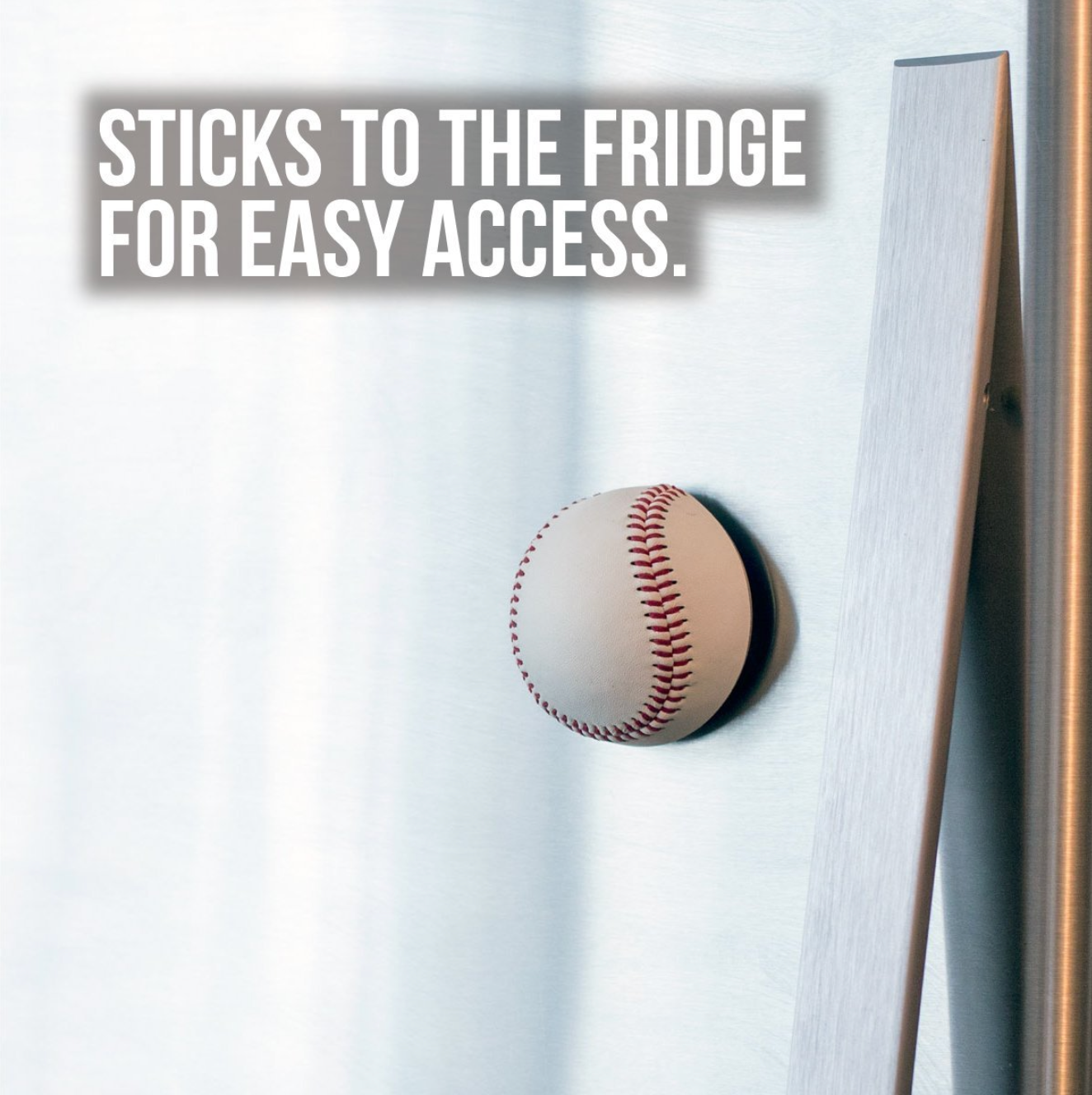 Baseball attached to a refrigerator with text 'Sticks to the fridge for easy access.'