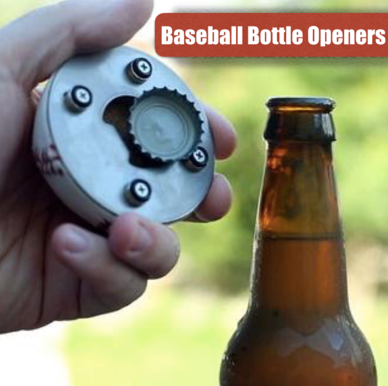 Hand holding a baseball-shaped bottle opener next to an amber glass bottle with a blurred green background.