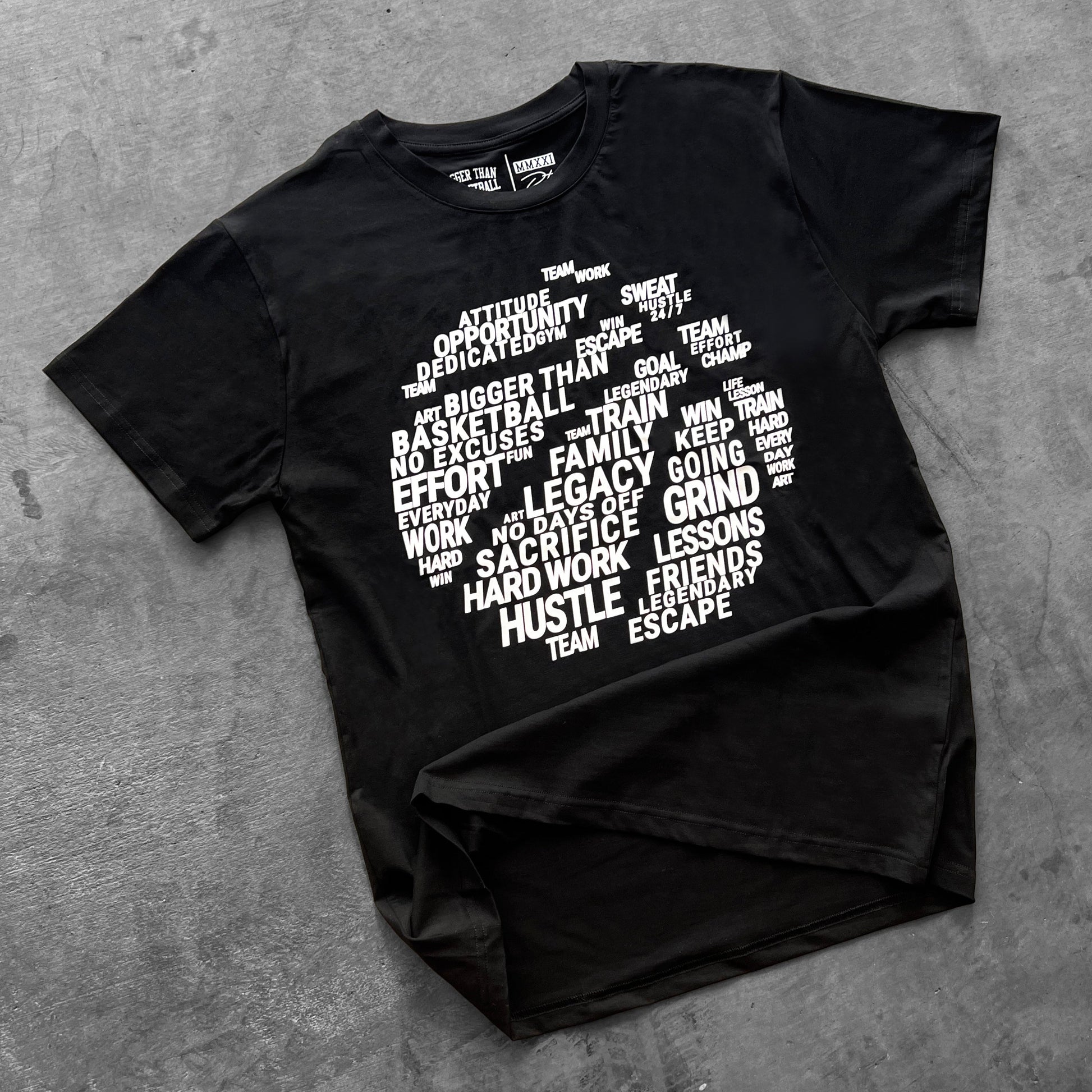 Black t-shirt with white text on a gray surface