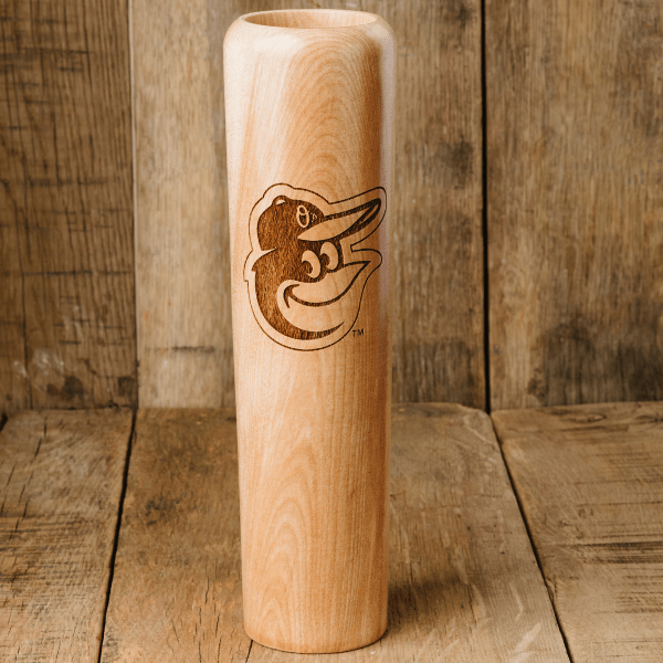 Wooden bat with laser engraving on a wooden background