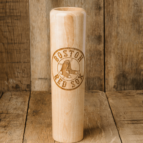Wooden baseball bat with Boston Red Sox logo on a wooden background