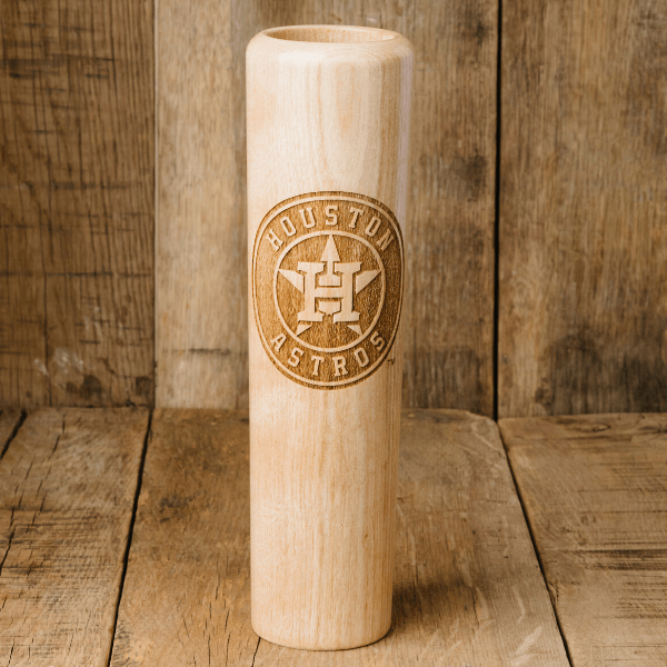 Wooden bat with Houston Astros logo on a wooden background