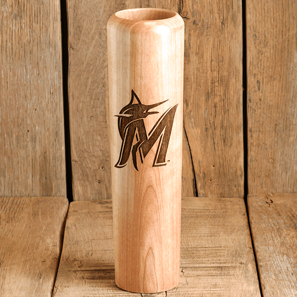 Wooden vase with engraved logo on a wooden background