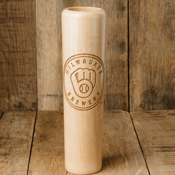 Wooden baseball bat with Milwaukee Brewers logo on a wooden background