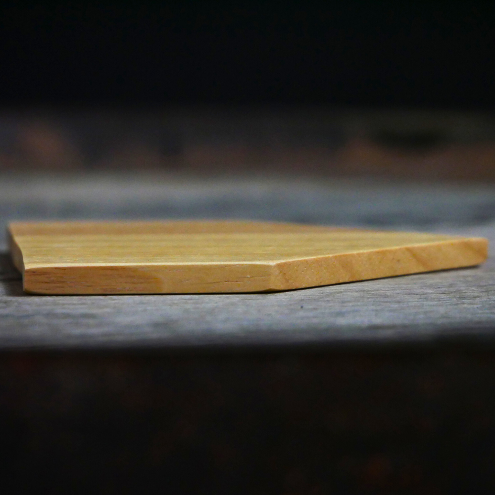 Wooden cutting board on a dark surface