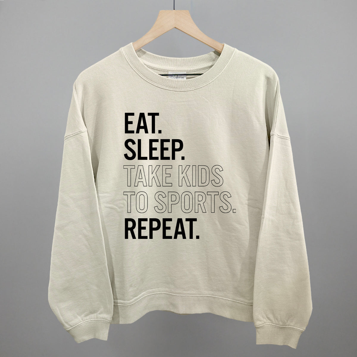 Collection of bone comfort colors sweatshirt with text on a gray background in a gallery layout