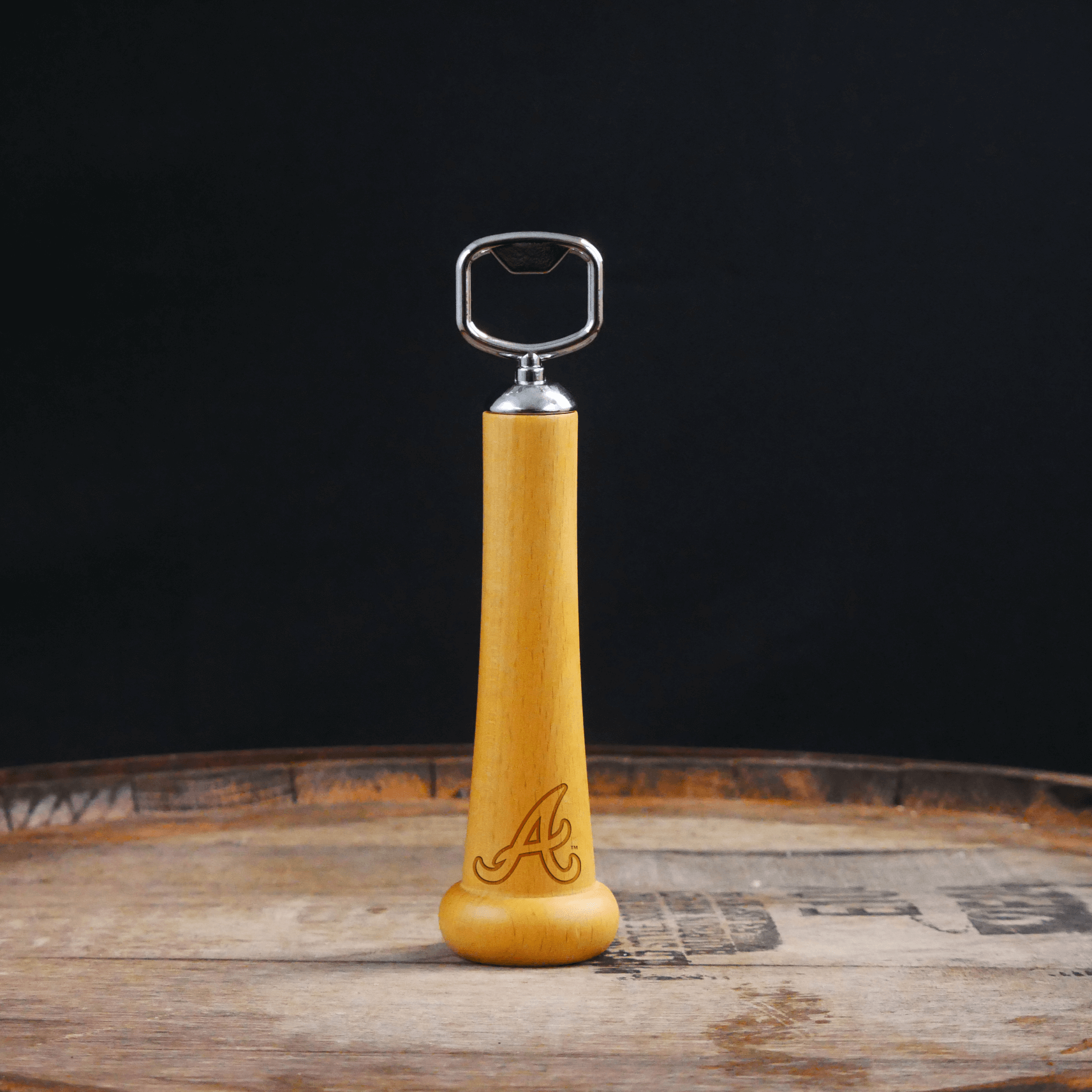 Collection of Wooden bottle opener with metal cap on a wooden surface and dark background in a gallery layout