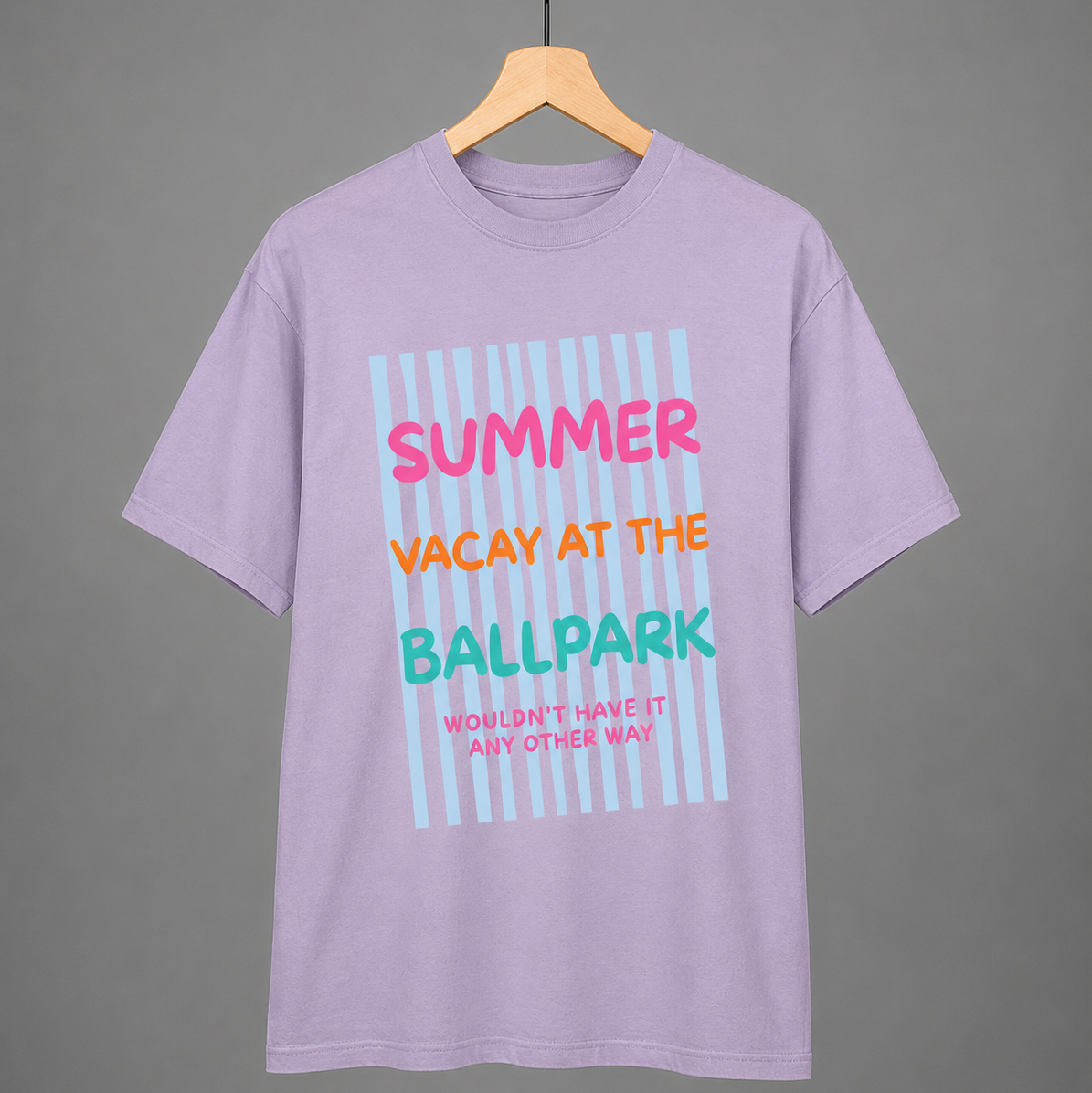 Purple t-shirt with colorful text on a hanger against a gray background
