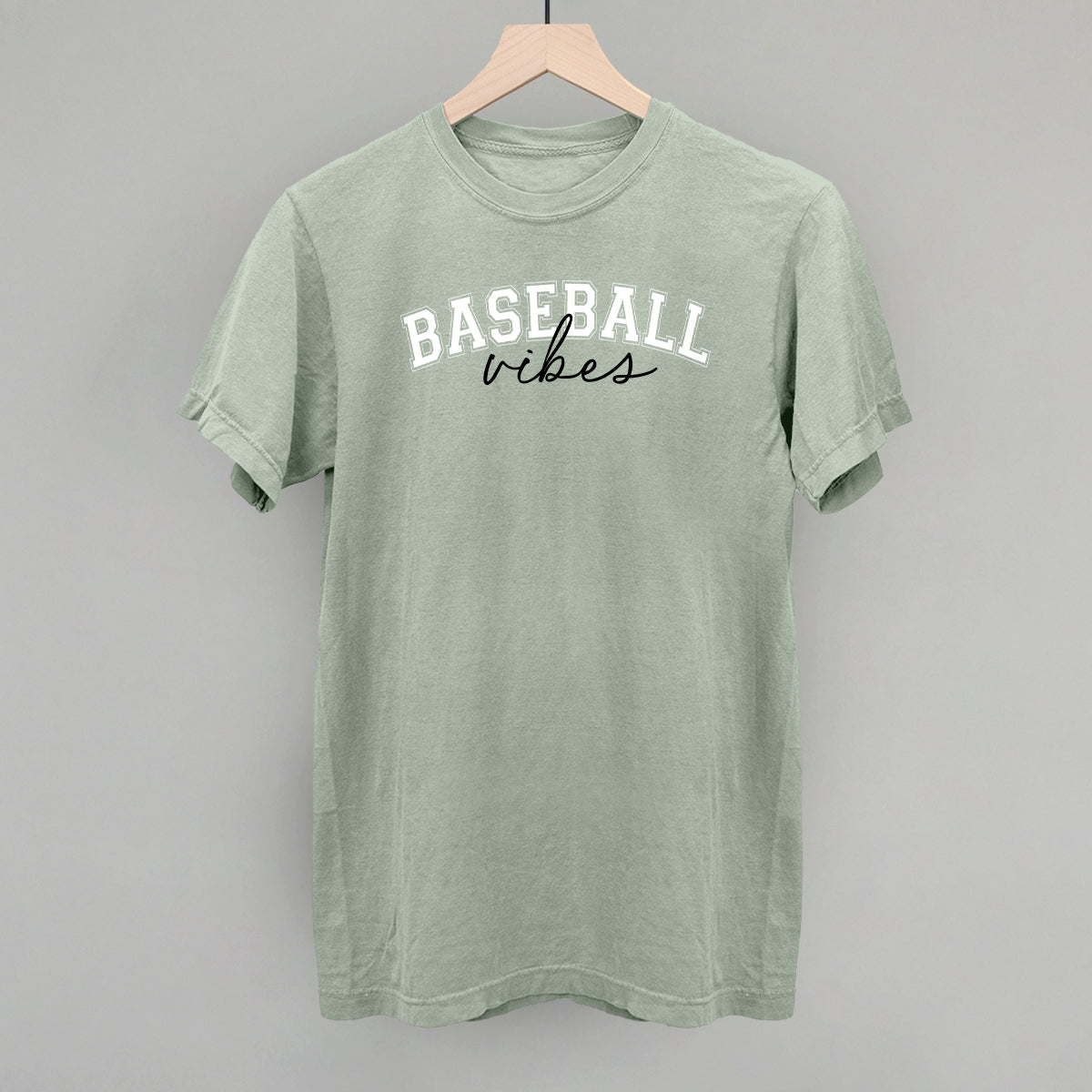 Green t-shirt with 'Baseball vibes' text on a gray background