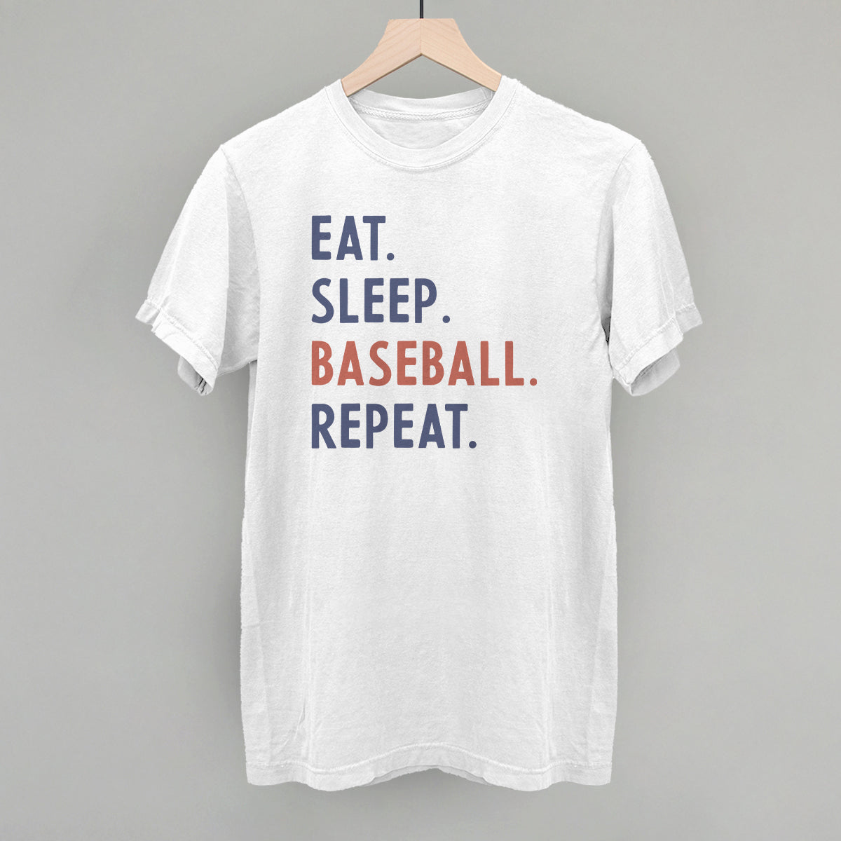 Collection of White t-shirt with 'Eat. Sleep. Baseball. Repeat.' text on a gray background in a gallery layout