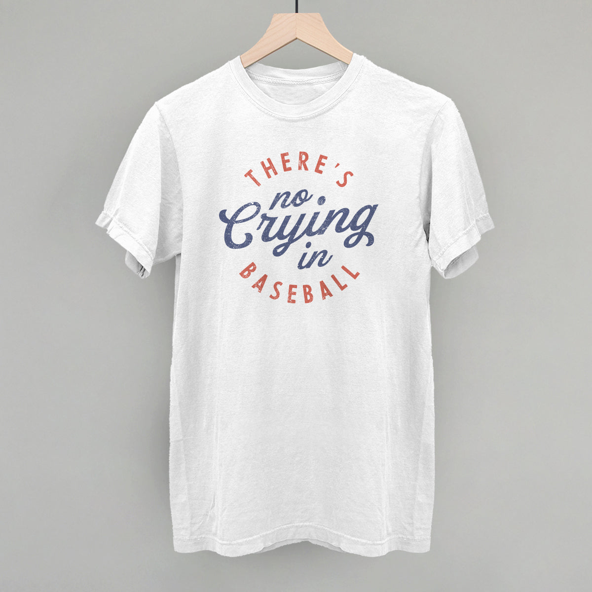 Collection of White t-shirt with 'There's no crying in baseball' text on a gray background in a gallery layout
