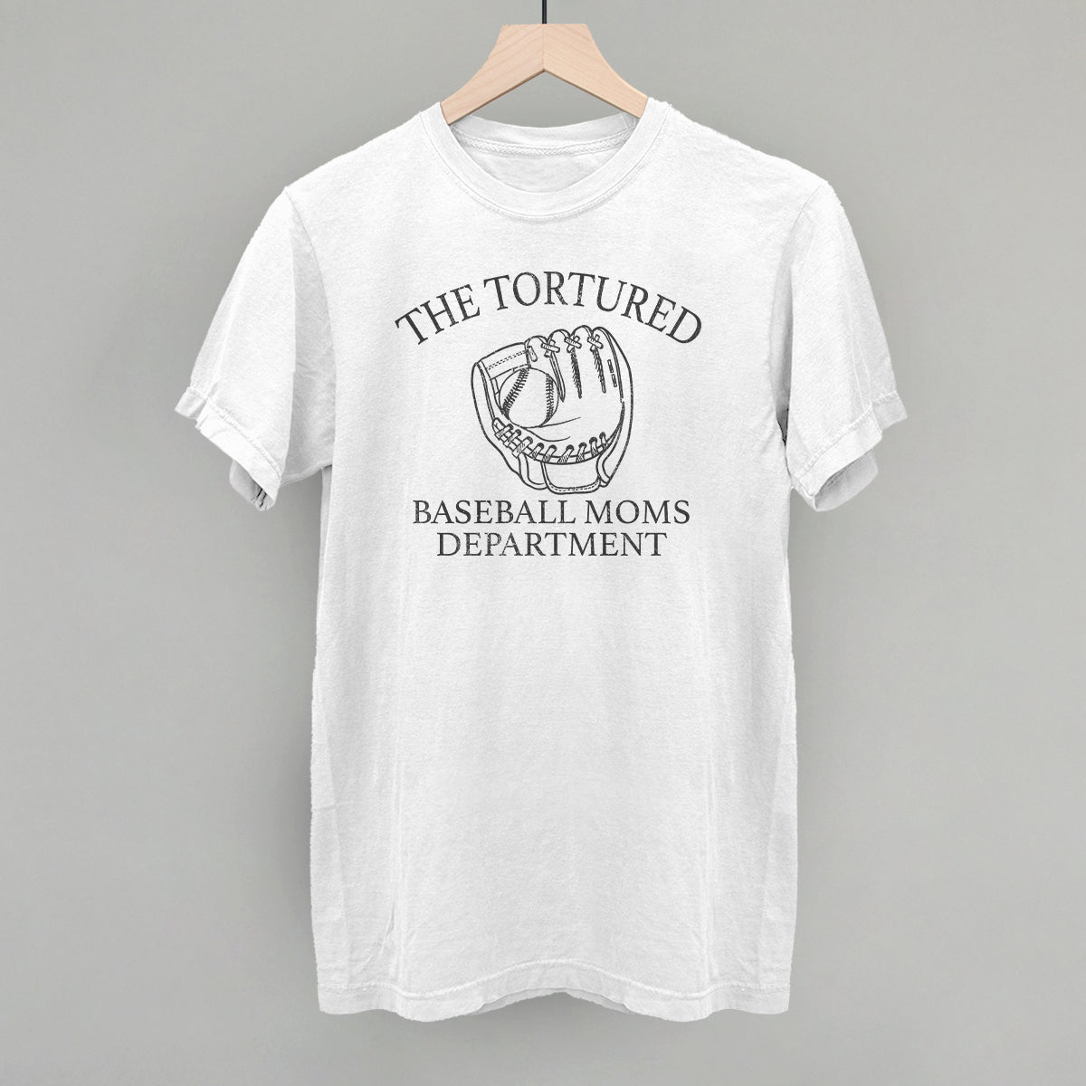 White t-shirt with 'The Tortured Baseball Moms Department' graphic on a gray background