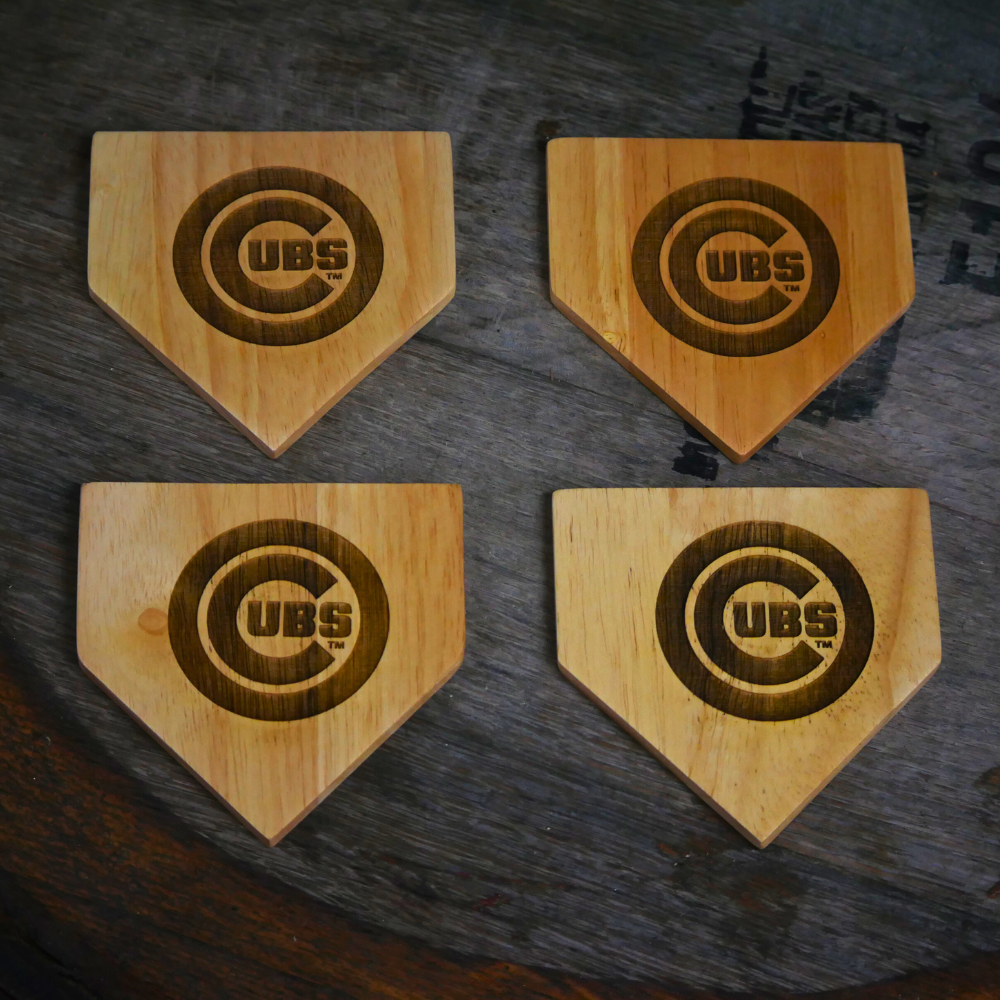 Collection of Four wooden coasters with Cubs logo on a dark surface in a gallery layout