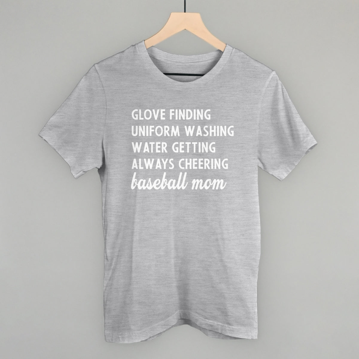 Collection of Gray comfort color t-shirt with white text on a hanger against a gray background in a gallery layout