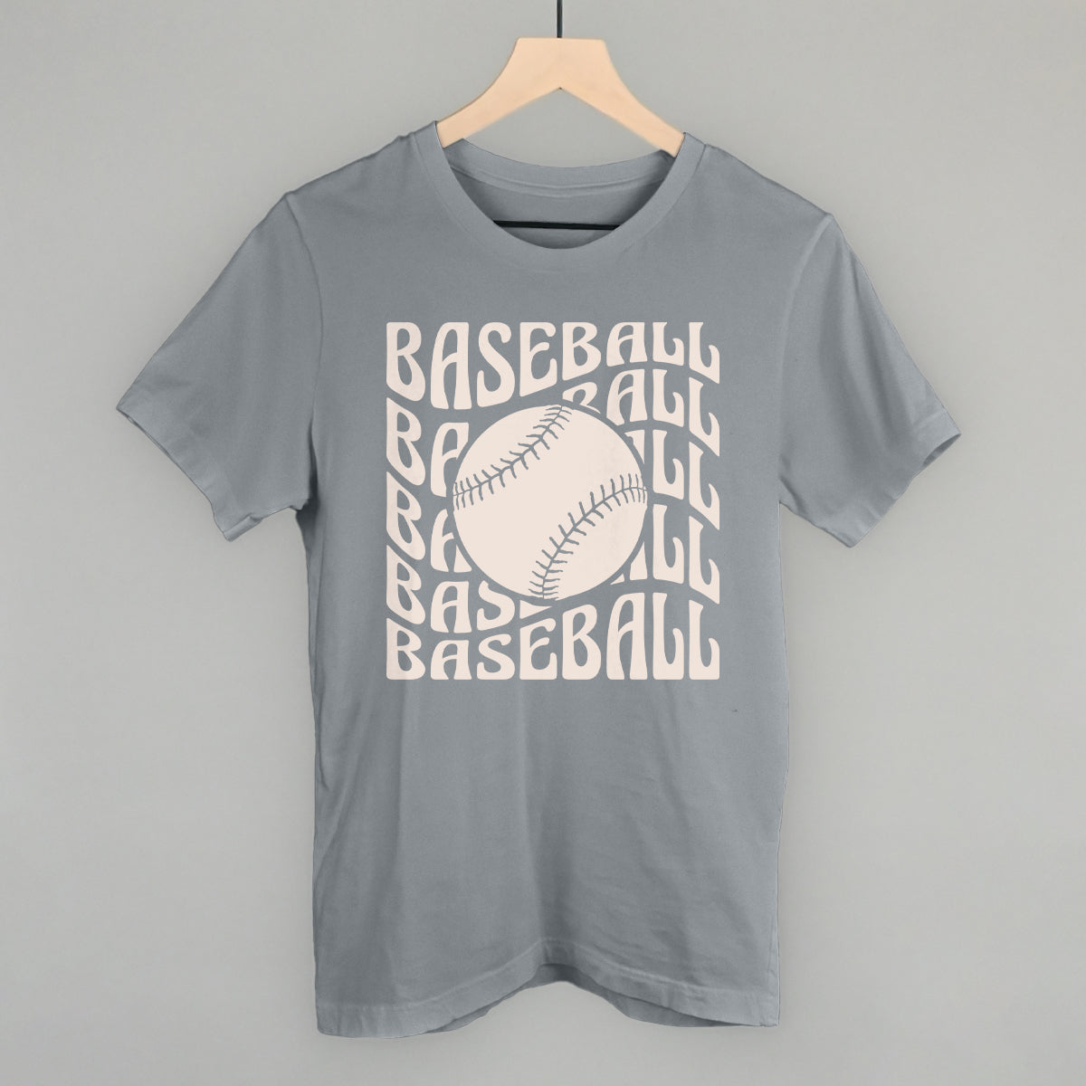 Collection of Gray t-shirt with 'BASEBALL' text and baseball graphic on a hanger against a gray background in a gallery layout
