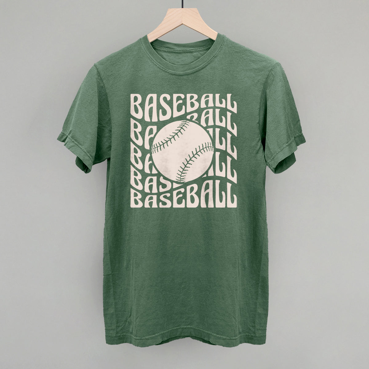 Green t-shirt with 'BASEBALL' text and a baseball graphic on a gray background