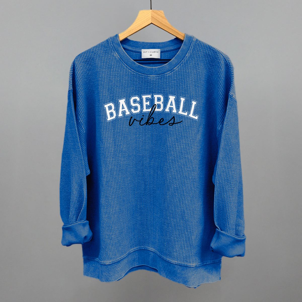 Collection of Blue sweatshirt with 'BASEBALL vibes' text on a gray background in a gallery layout