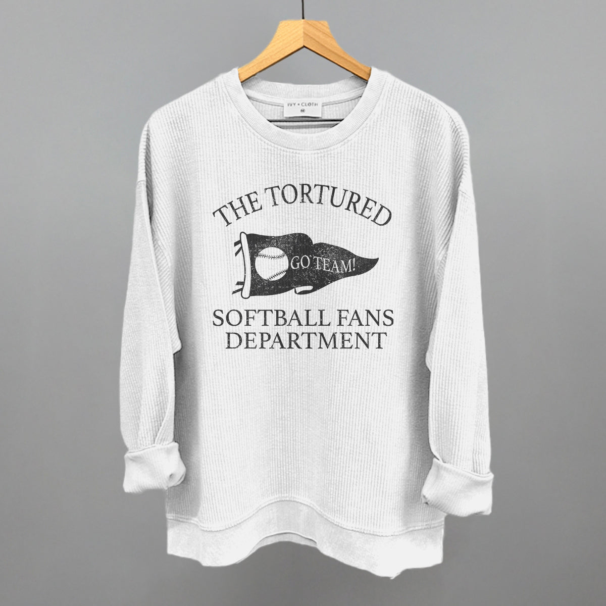Collection of White corded sweatshirt with text that says the tortured Softball fans department  in a gallery layout