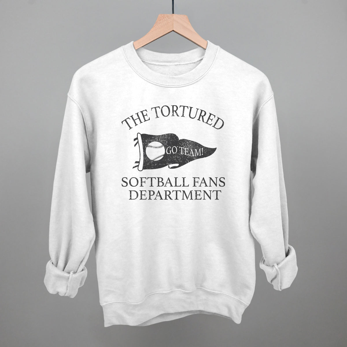 Collection of White sweatshirt with black text that says the tortured Softball fans department  in a gallery layout