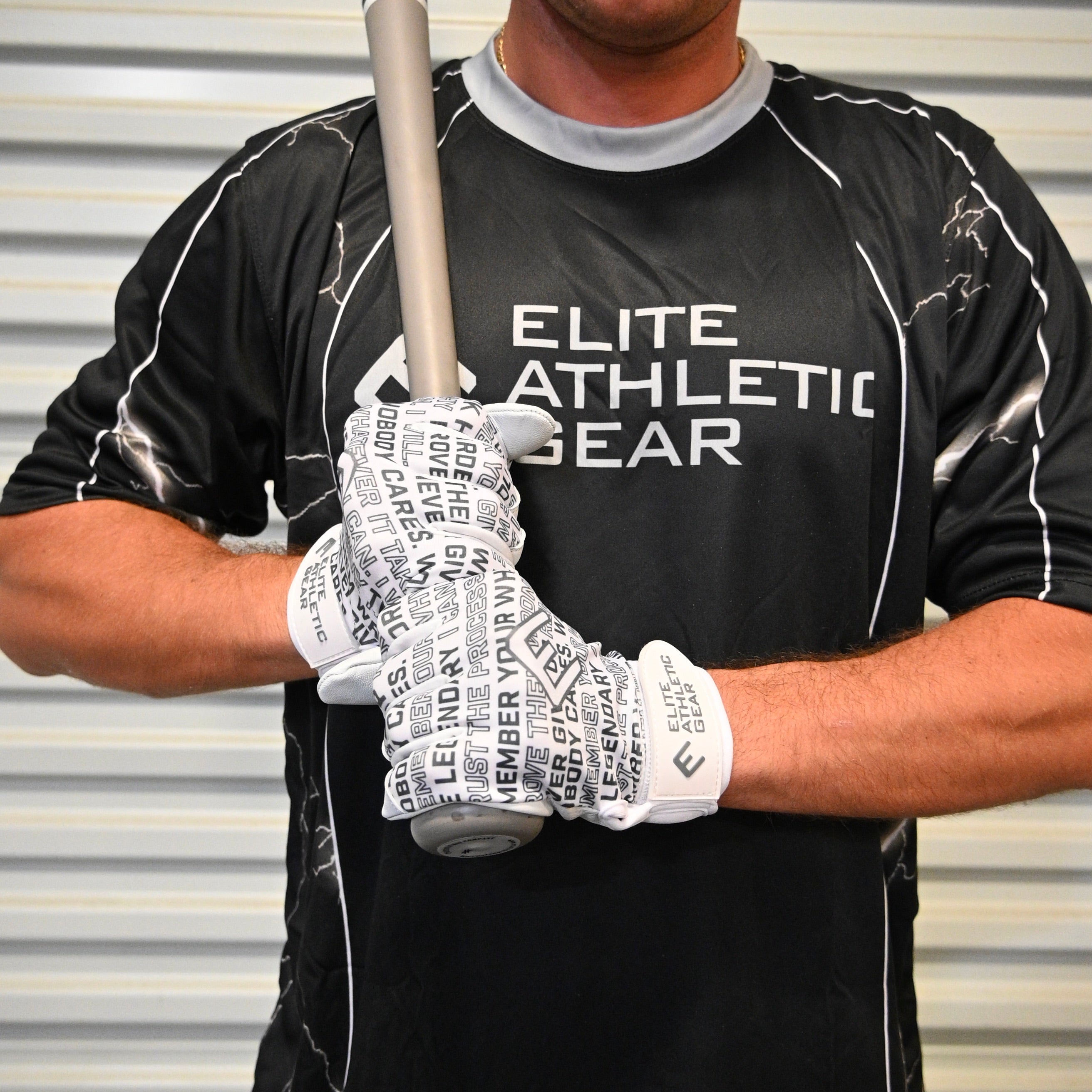 Collection of Person wearing a black 'Elite Athletic Gear' shirt and white gloves with text, holding a baseball bat. in a gallery layout