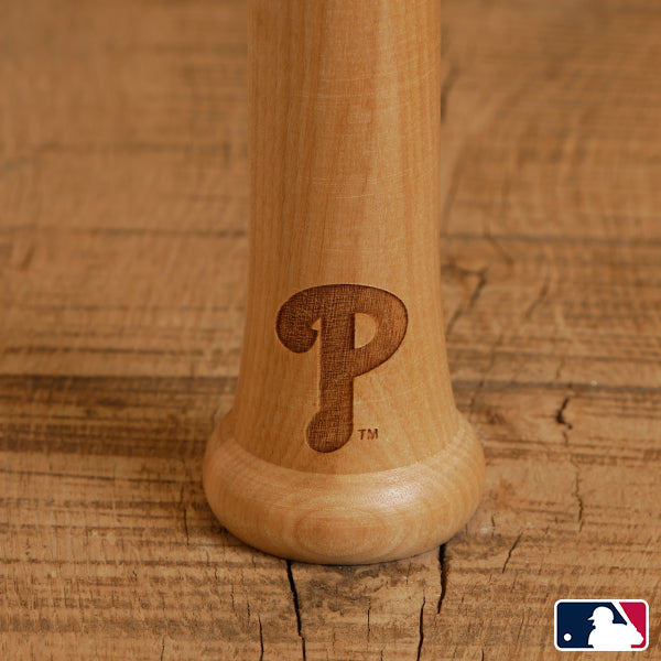 Collection of Wooden baseball bat with a logo on a wooden background in a gallery layout