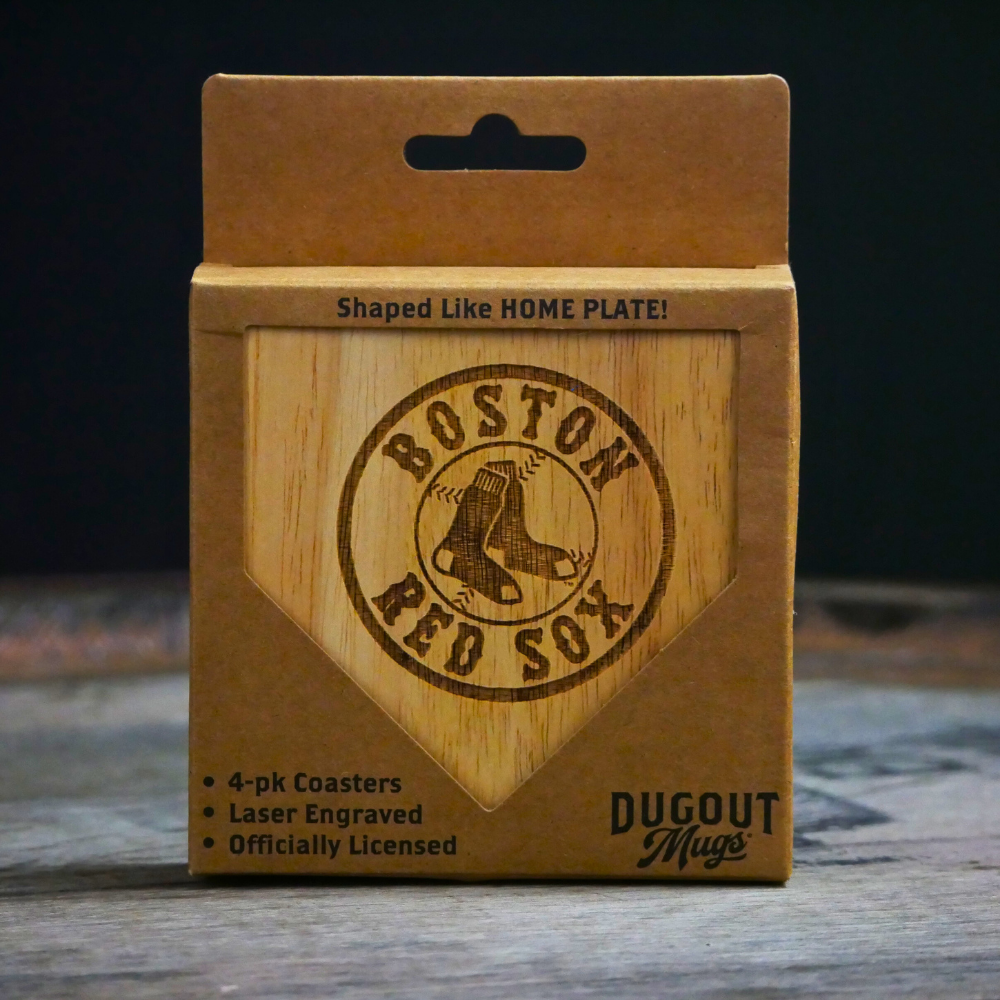 Packaging of Boston Red Sox coasters shaped like a home plate on a wooden surface.