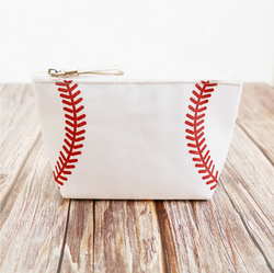 Collection of White pouch with red stitching design on a wooden surface in a gallery layout