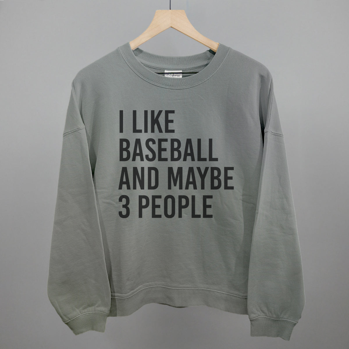 smoke sweatshirt with 'I LIKE BASEBALL AND MAYBE 3 PEOPLE' text on a gray background