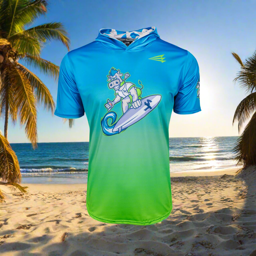 Blue and green hoodie with a graphic design on a beach