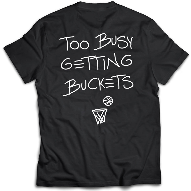 Collection of Black t-shirt with 'Too Busy Getting Buckets' text and basketball graphics on a white background in a gallery layout