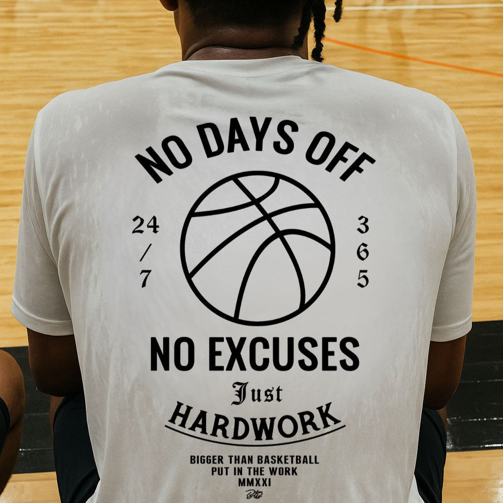 Collection of Person wearing a t-shirt with motivational text and a basketball graphic on a gymnasium floor. No days off white t shirt in a gallery layout