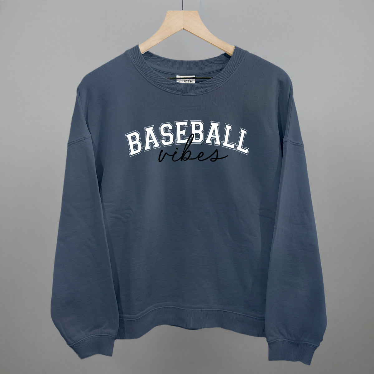 Collection of Navy blue sweatshirt with 'BASEBALL vibes' text on a gray background in a gallery layout