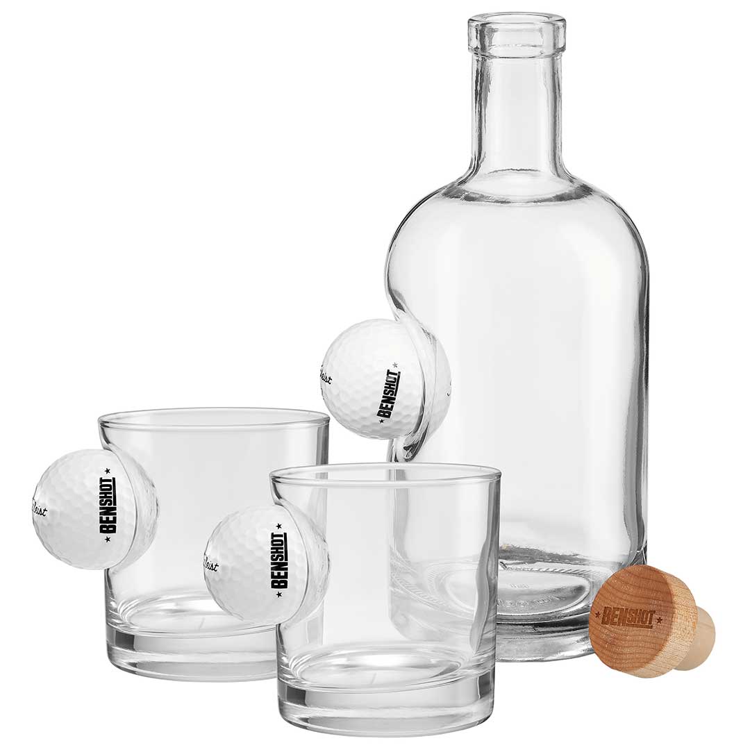Collection of Clear glass decanter set with three shot glasses and a wooden stopper on a white background. in a gallery layout