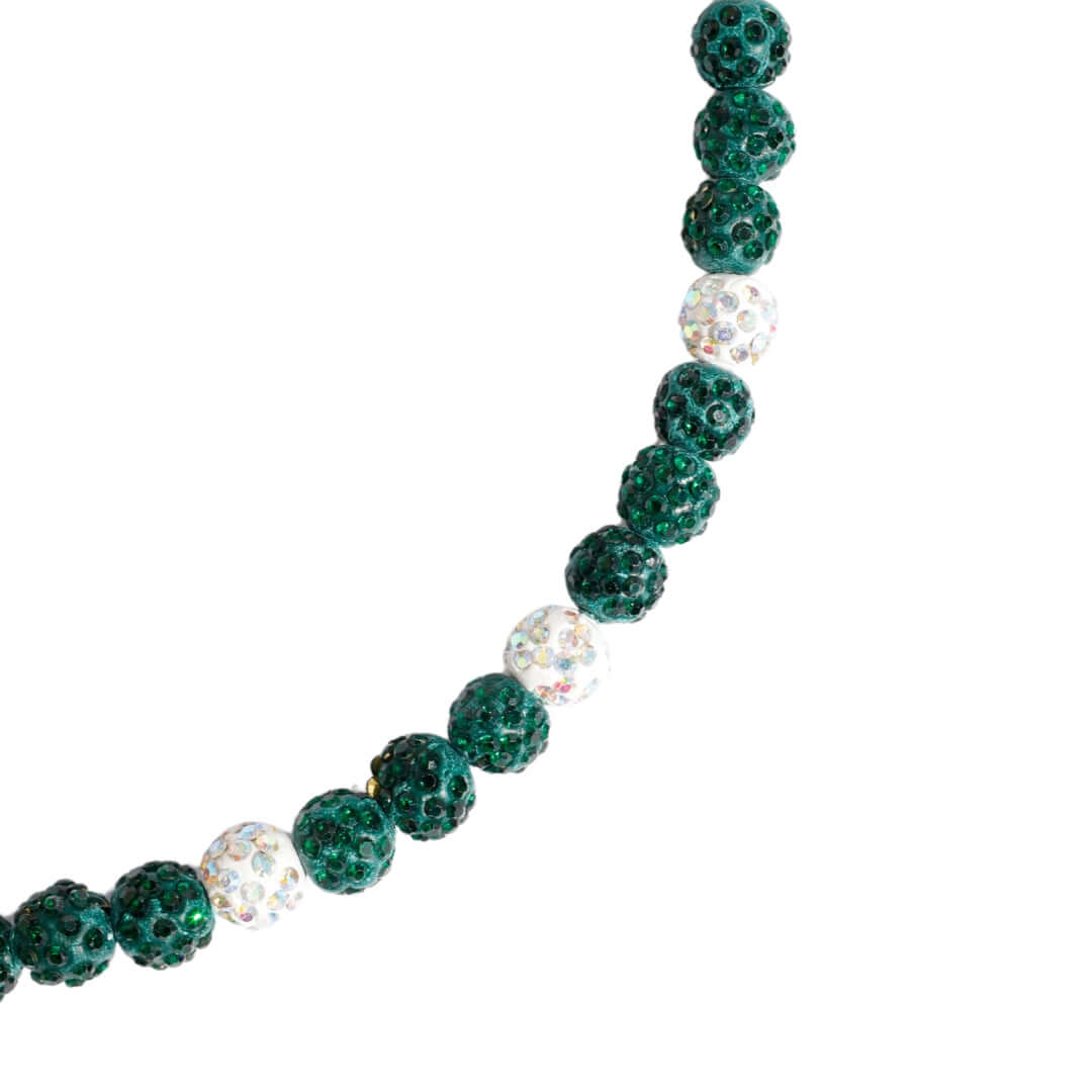 Necklace with green and clear beads on a white background