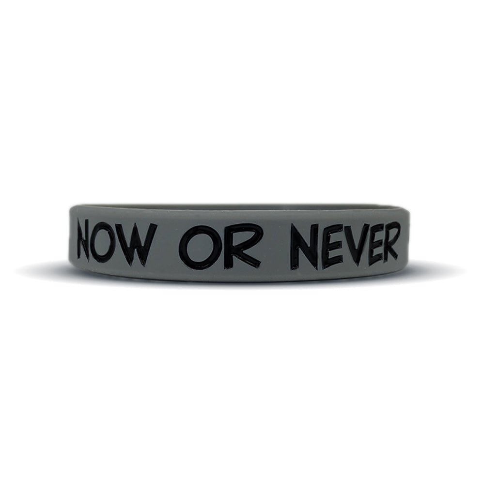 Collection of Gray wristband with 'NOW OR NEVER' text on a white background in a gallery layout