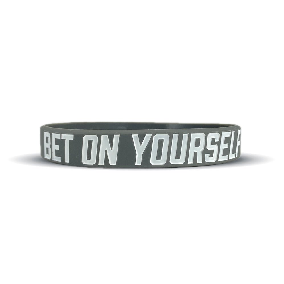 Collection of Black wristband with 'BET ON YOURSELF' text on a white background in a gallery layout
