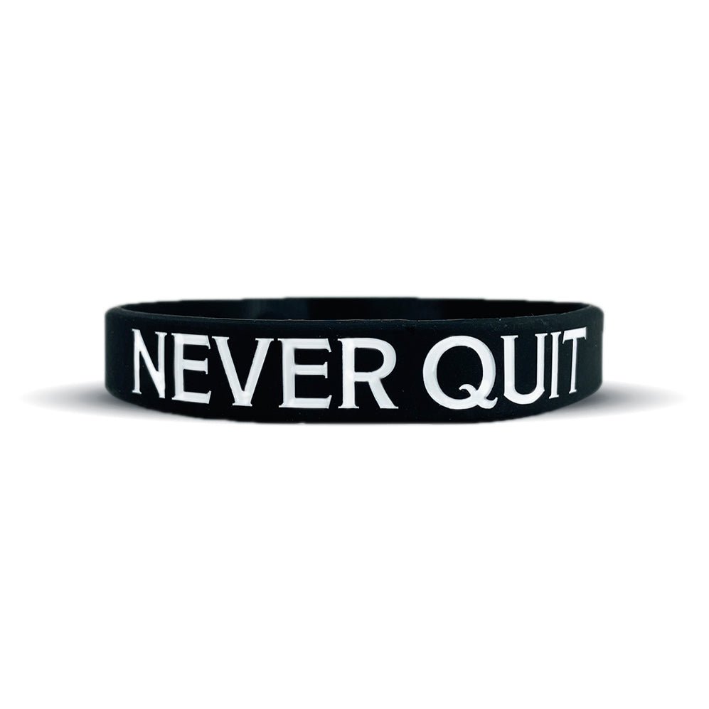 Collection of Black wristband with 'NEVER QUIT' text on a white background in a gallery layout