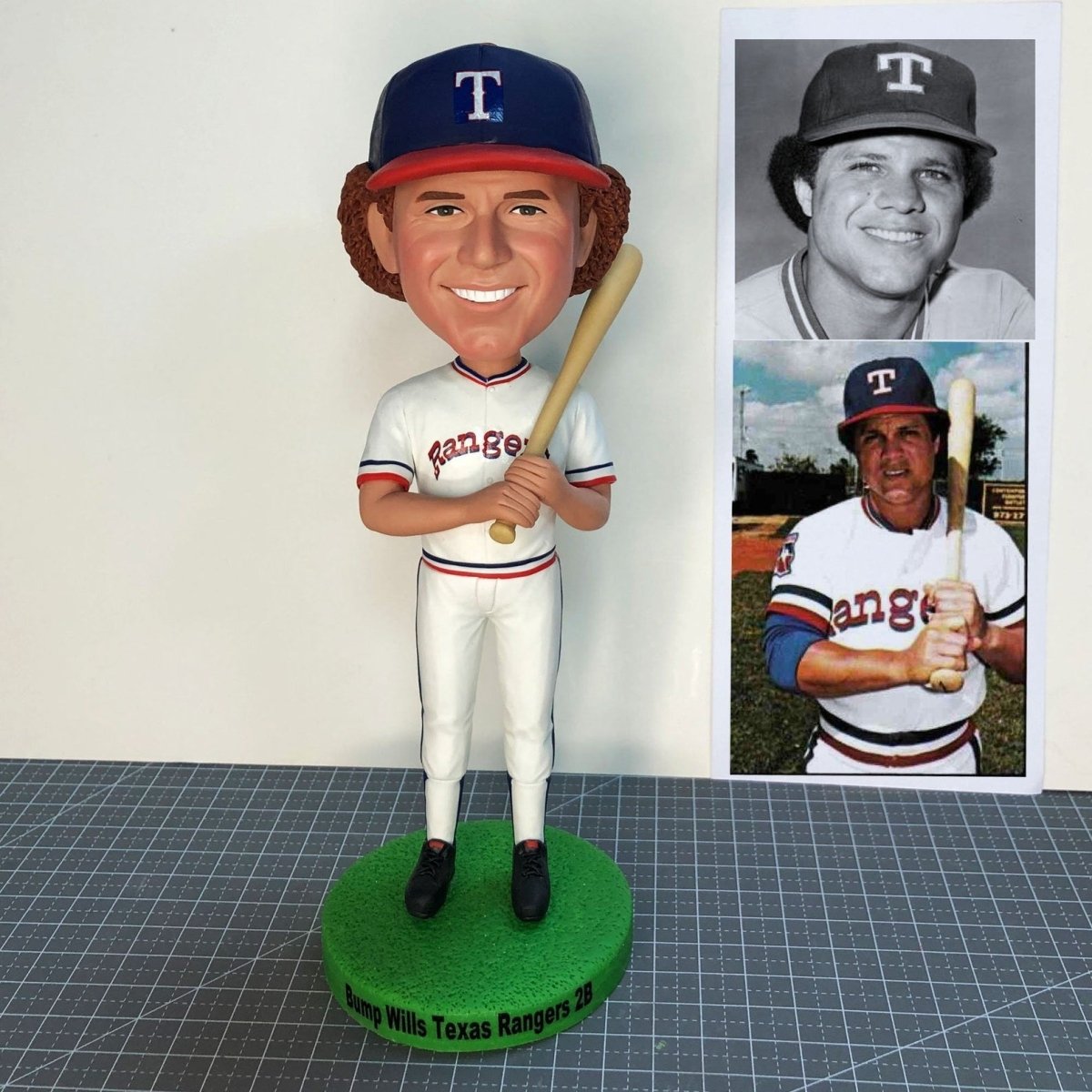 Bobblehead of a baseball player in Texas Rangers uniform with a photo of the player on the right.
