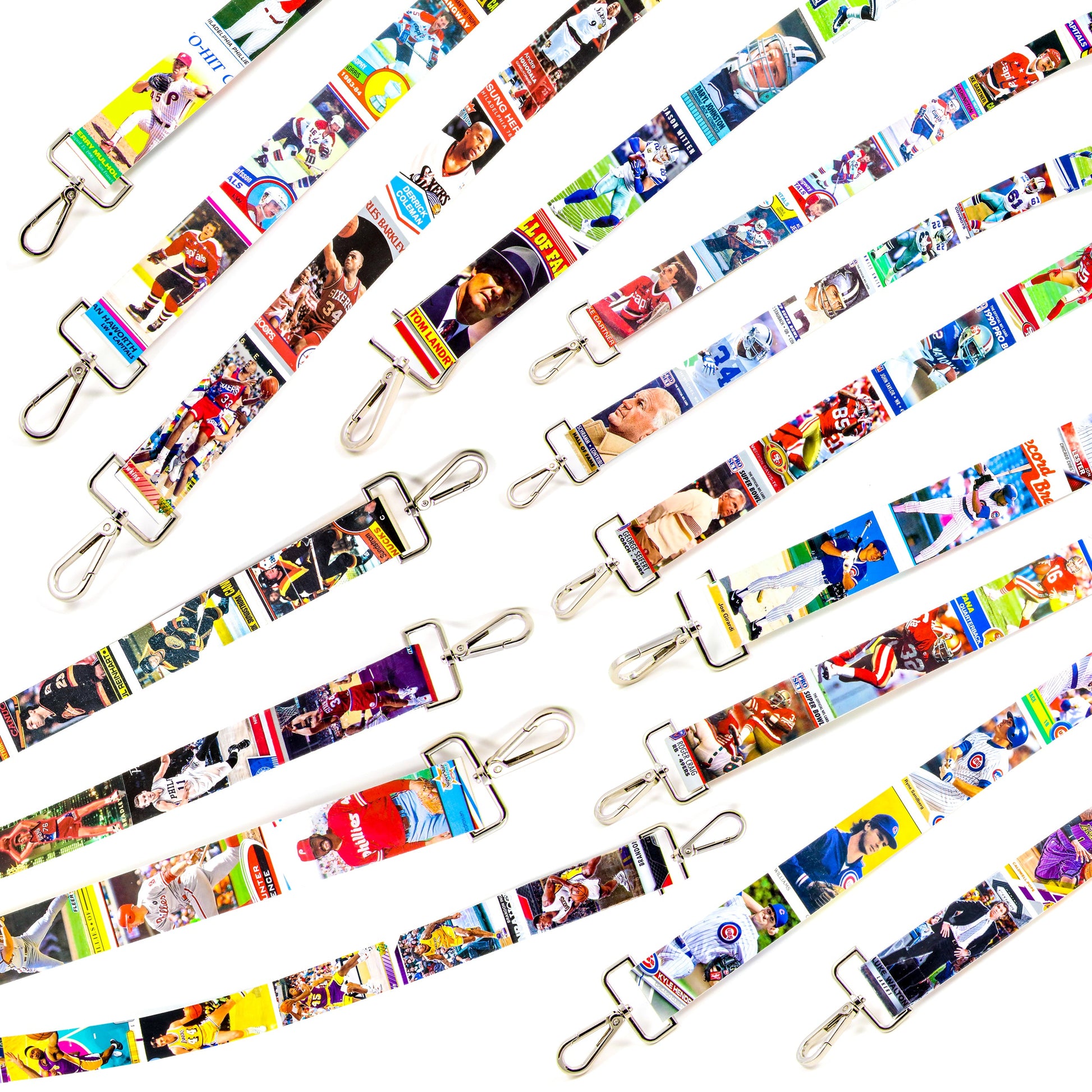 Collection of sports card purse straps on a white background